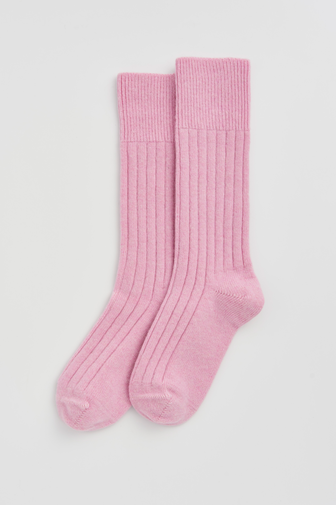 Sugar Pink Merino Bed Socks: Pink merino bed socks in soft, ribbed design for cozy comfort.