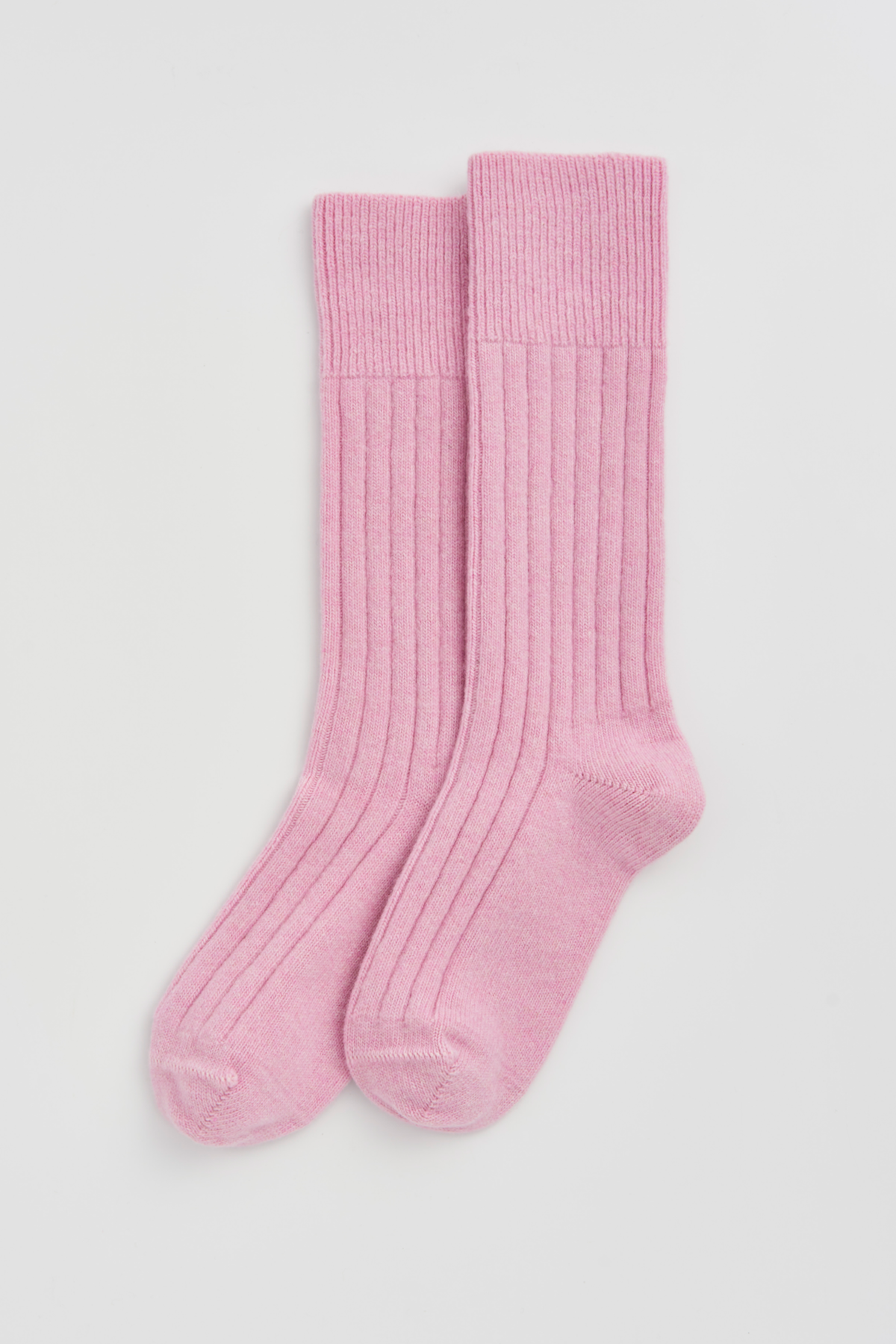 Sugar Pink Merino Bed Socks: Pink merino bed socks in soft, ribbed design for cozy comfort.